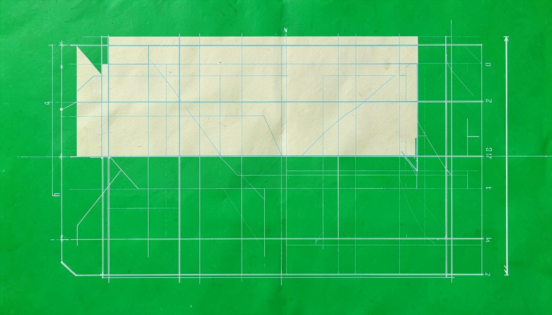 Technical blueprint sketch on parchment-toned paper, showing clean geometric linework in pale blue ink with faint grid markings